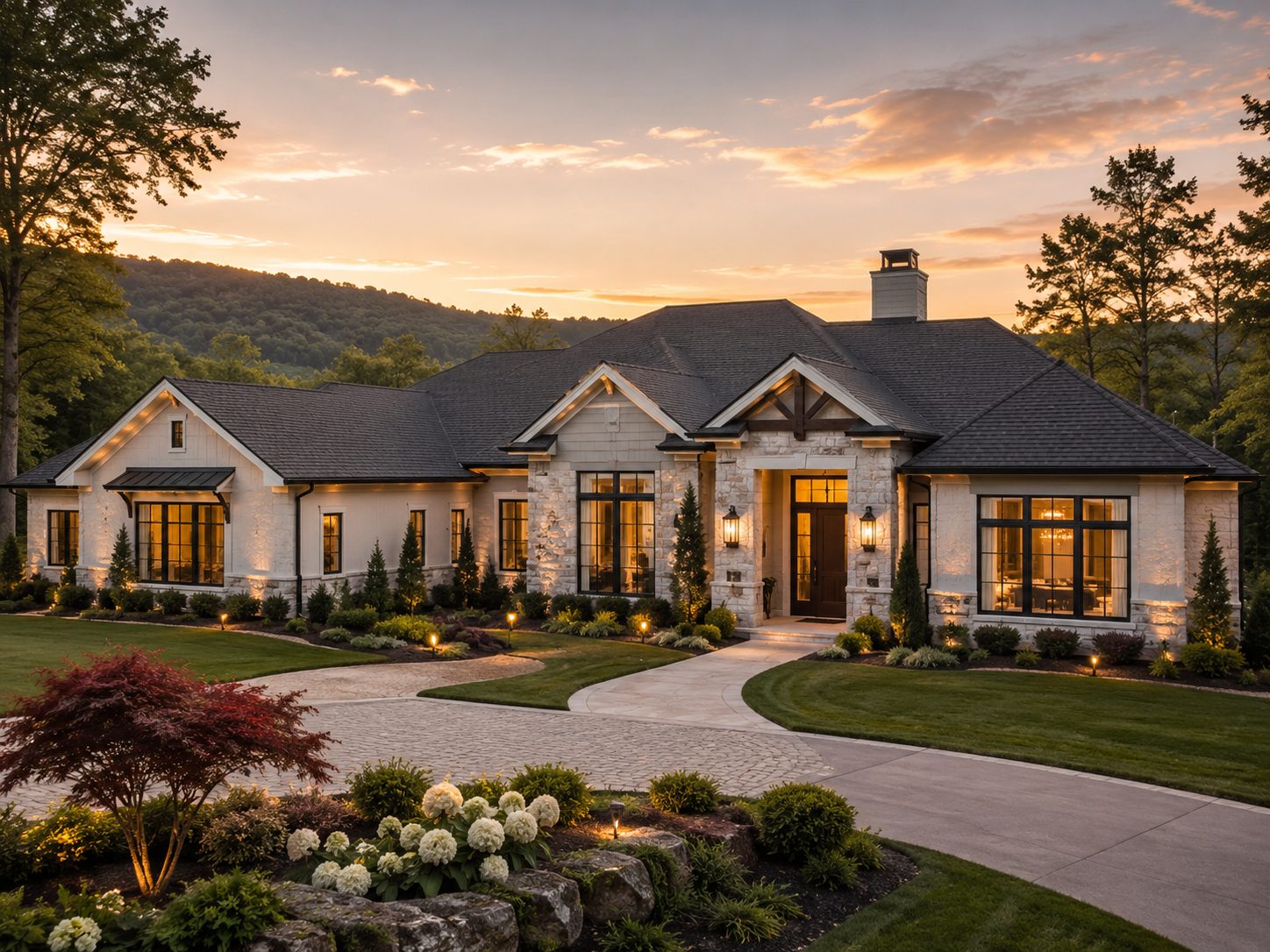 Single story ranch-style home with landscaped yard at sunset